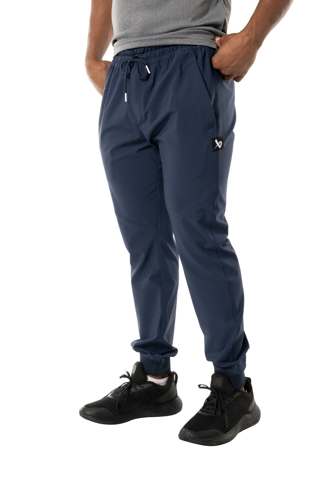 https://www.thehockeyshop.com/cdn/shop/files/bauer-canada-team-pants-s23-bauer-team-woven-senior-joggers-navy-m-30850447802434_1080x.jpg?v=1698422569