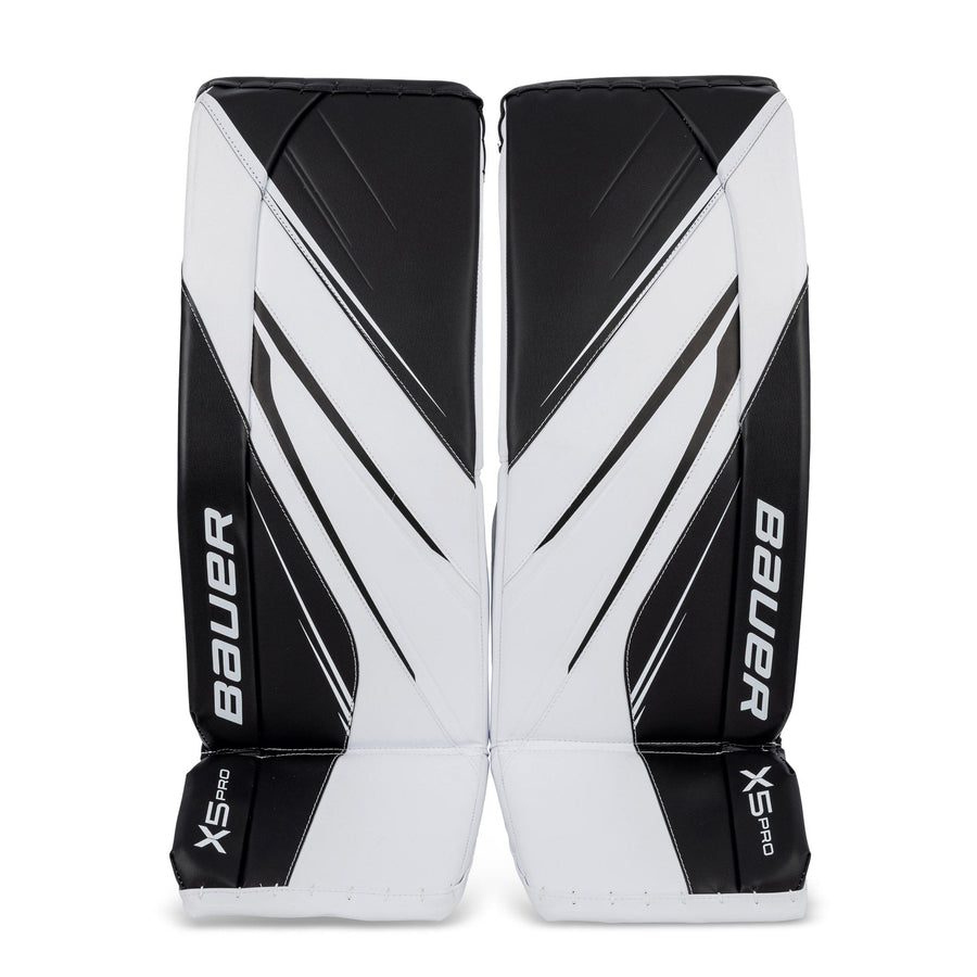 https://www.thehockeyshop.com/cdn/shop/files/bauer-leg-pads-bauer-vapor-x5-pro-intermediate-goalie-leg-pads-white-black-l-30440706572354_900x.jpg?v=1684441620